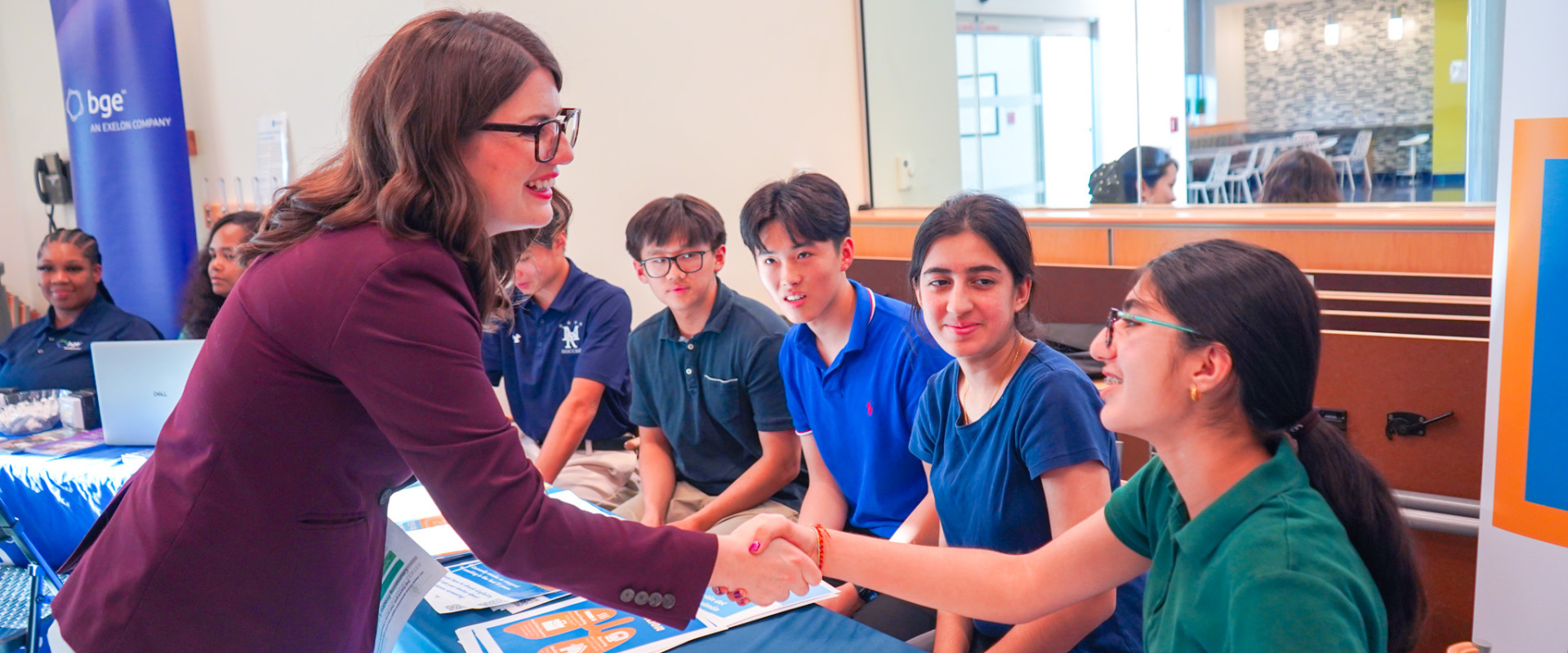 Elfreth shakes hand of middle schooler at Constituent Resource Fair