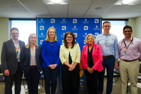 Maryland officials and Chase Brexton doctors pose for a photo