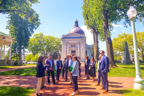 Members of Congress stand outside Naval Academy