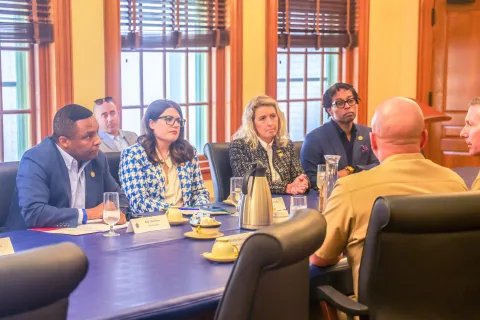 Members sit down to speak with officers at Naval Academy