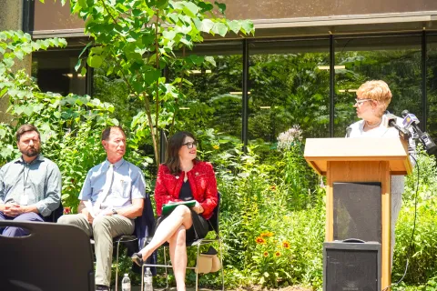 Elfreth smiles at speaker for Anne Arundel County Community Action Agency