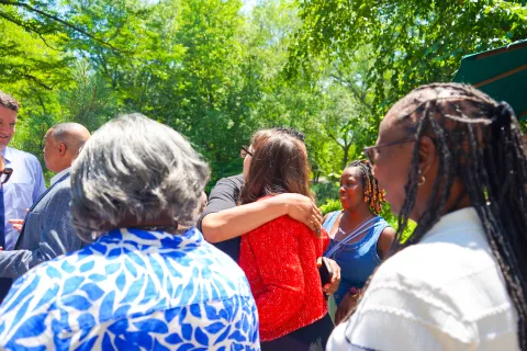Elfreth hugs attendee