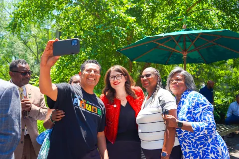 Elfreth takes a photo with attendees