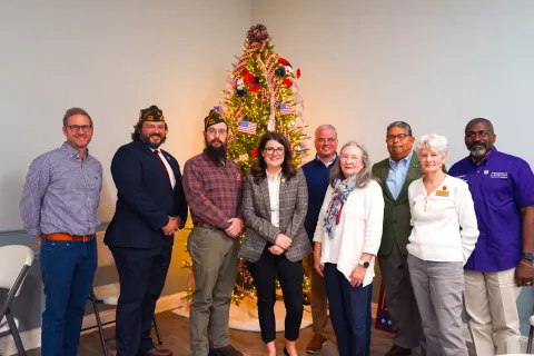 Elfreth takes a photo with vets at the Vets Roundtable