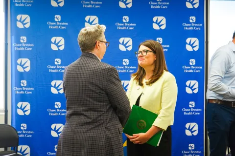 Elfreth smiles at Chase Brexton Director