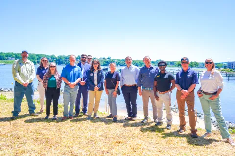 Elfreth stands at restored shoreline for whole watershed project
