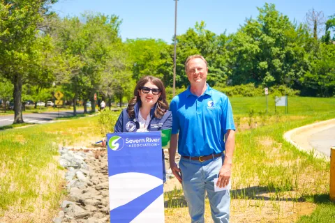 Elfreth poses with Jesse from SRA in front of whole watershed project
